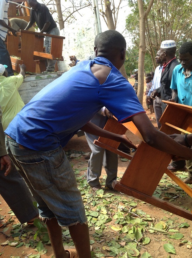unloading desks for Masasi Villages project  funded by African Palms selling palm crosses