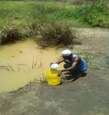 A man at Mtwara region collecting water 