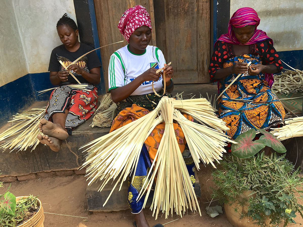 Group of women at Masasi village handwoven palm crosses 