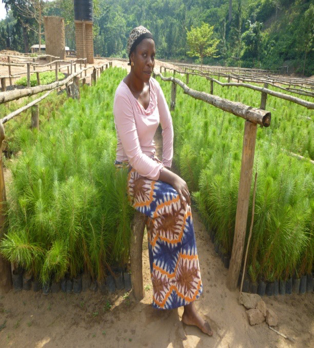 a women posing at Rondo tree planting project were the trees flourish